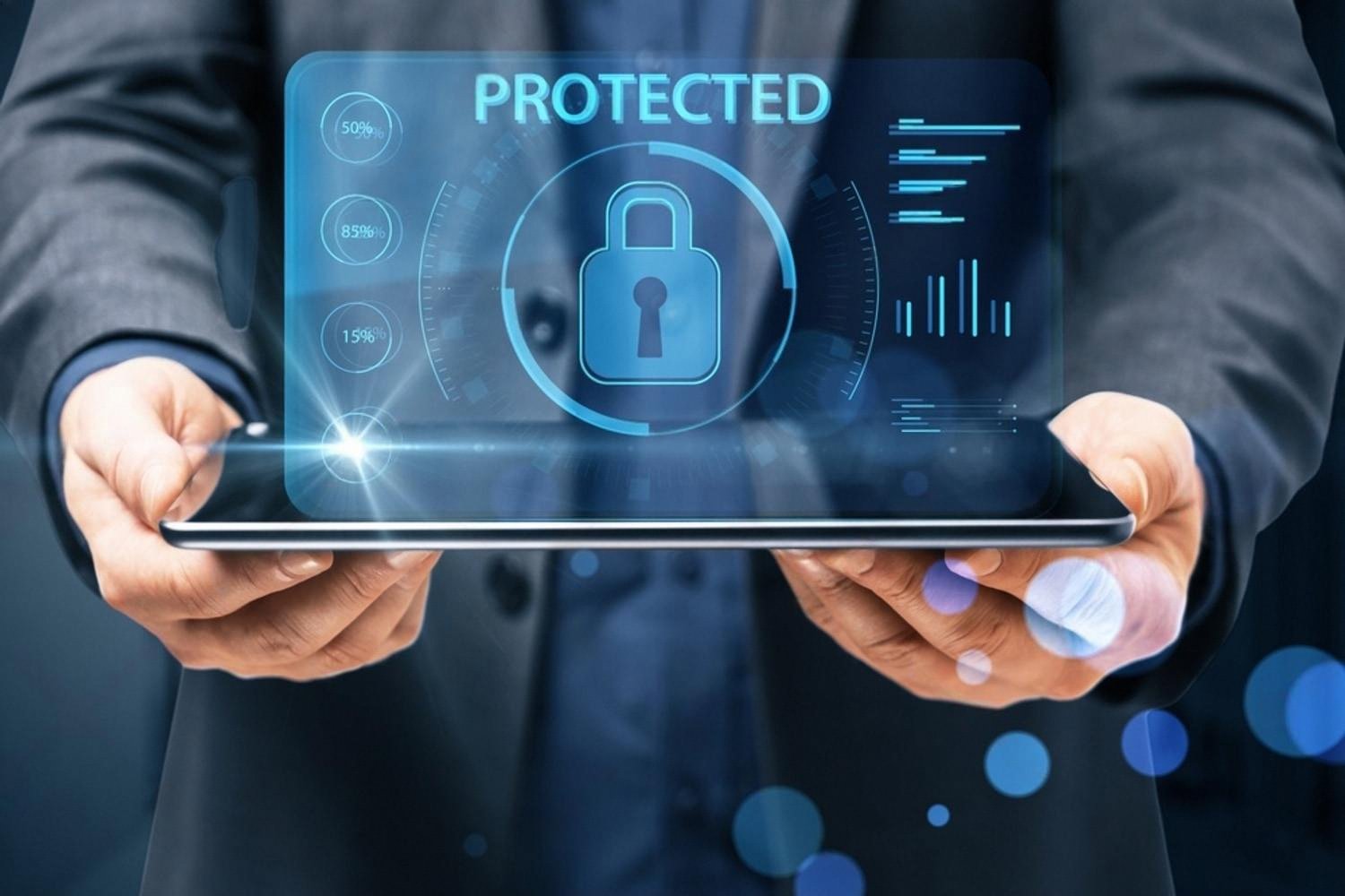 Businessman holding a tablet showing a shield labelled Protected, illustrating cybersecurity for UAE companies
